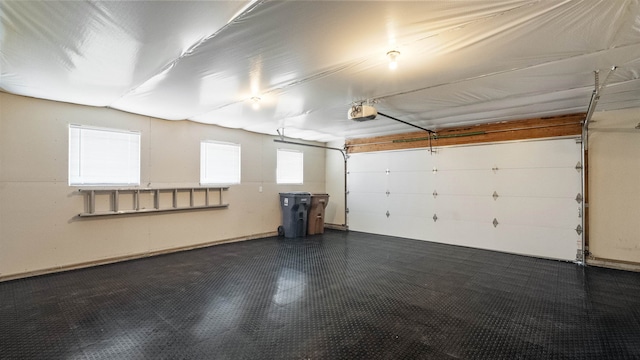 3404 W Excell Ave, Spokane, WA 99208 - garage featuring a garage door opener and baseboards