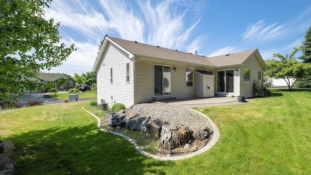3404 W Excell Ave, Spokane, WA 99208 - back of property featuring a patio area, a lawn, cooling unit, and a shingled roof