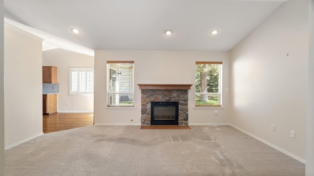 3404 W Excell Ave, Spokane, WA 99208 - unfurnished living room with light colored carpet, a fireplace, baseboards, vaulted ceiling, and recessed lighting
