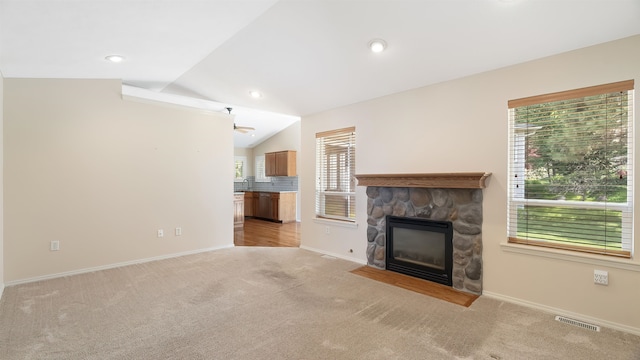 3404 W Excell Ave, Spokane, WA 99208 - unfurnished living room with a fireplace, lofted ceiling, light carpet, baseboards, and recessed lighting