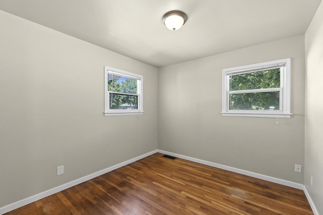 5607 N Elgin St, Spokane, WA 99205 - spare room with baseboards and dark wood-type flooring