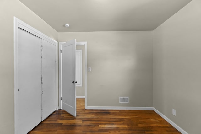 5607 N Elgin St, Spokane, WA 99205 - unfurnished bedroom with wood finished floors, a closet, and baseboards