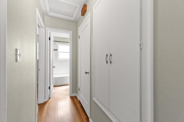 5607 N Elgin St, Spokane, WA 99205 - corridor featuring light wood-style flooring, a textured wall, attic access, and baseboards