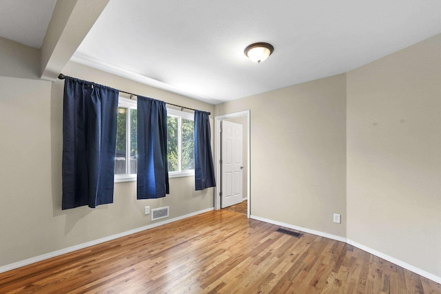 5607 N Elgin St, Spokane, WA 99205 - spare room featuring wood finished floors and baseboards