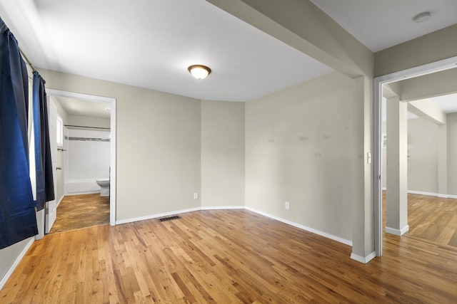 5607 N Elgin St, Spokane, WA 99205 - empty room with light wood-style floors, baseboards, and a smoke detector