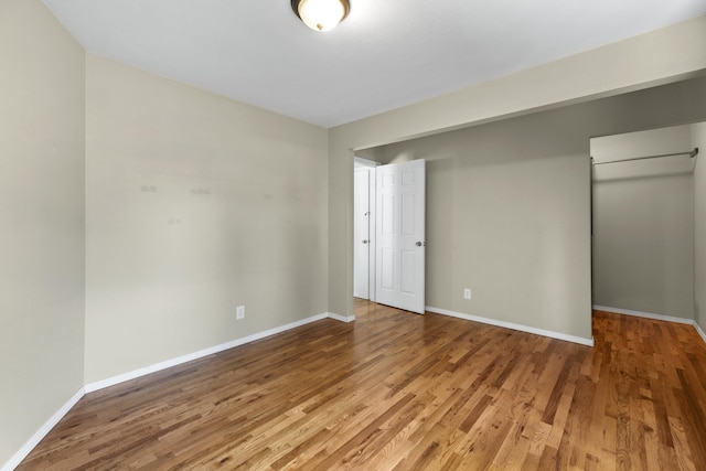 5607 N Elgin St, Spokane, WA 99205 - unfurnished bedroom featuring light wood-style floors, baseboards, and a closet