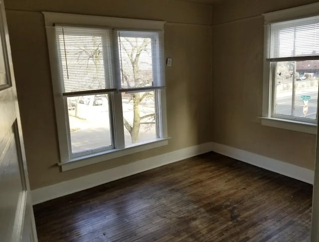 1101 W Maxwell Ave, Spokane, WA 99201 - spare room with dark wood-style flooring and baseboards