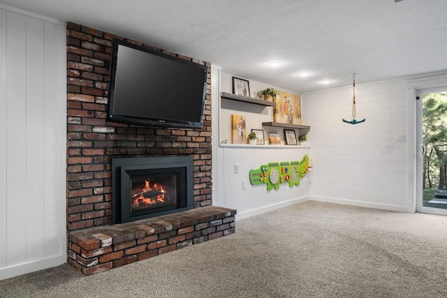 12327 E Sioux Cir, Spokane Valley, WA 99206 - unfurnished living room with carpet, a fireplace, baseboards, wood walls, and a textured ceiling