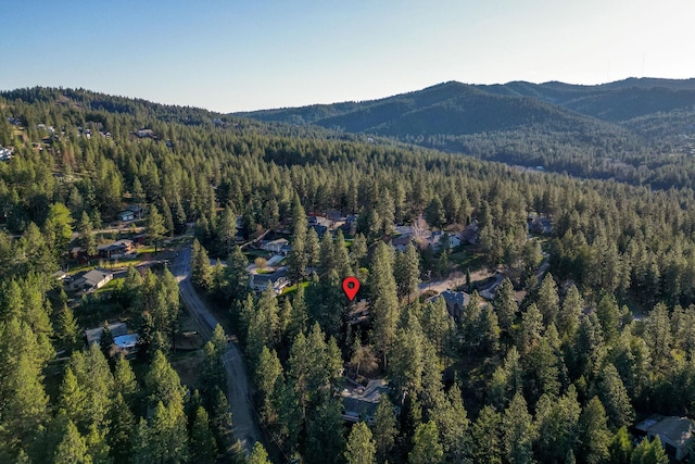 12327 E Sioux Cir, Spokane Valley, WA 99206 - aerial overview of property's location featuring a heavily wooded area and mountains