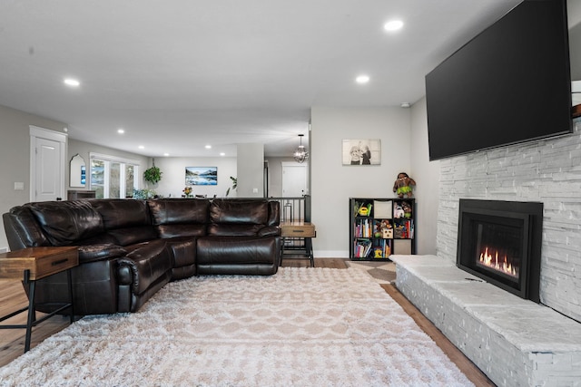 12327 E Sioux Cir, Spokane Valley, WA 99206 - living area featuring wood finished floors, recessed lighting, a fireplace, and baseboards