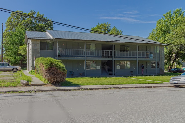 330 E 4th Ave, Colville, WA 99114 - view of property featuring stairs, a front lawn, and metal roof