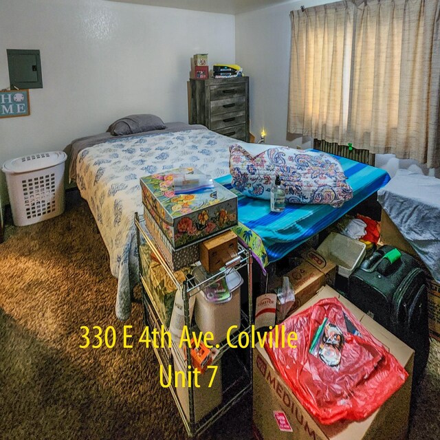 330 E 4th Ave, Colville, WA 99114 - bedroom featuring electric panel and carpet floors