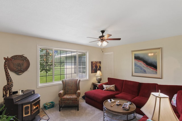 20201 E Lincoln Rd, Otis Orchards, WA 99027 - living area with a wood stove, a ceiling fan, and carpet