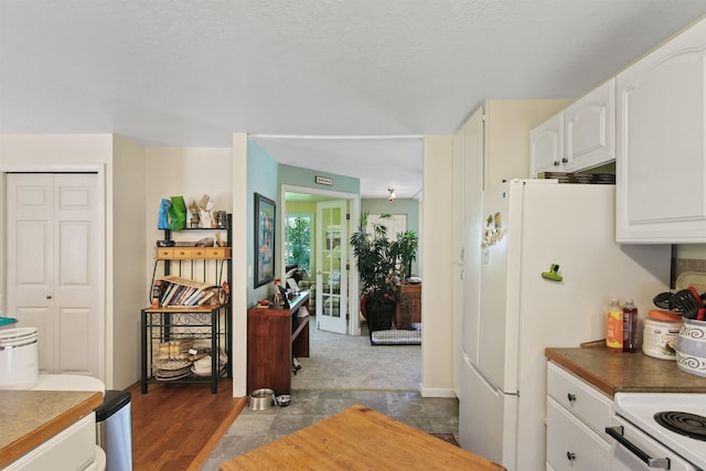 20201 E Lincoln Rd, Otis Orchards, WA 99027 - kitchen with white cabinets and dark countertops