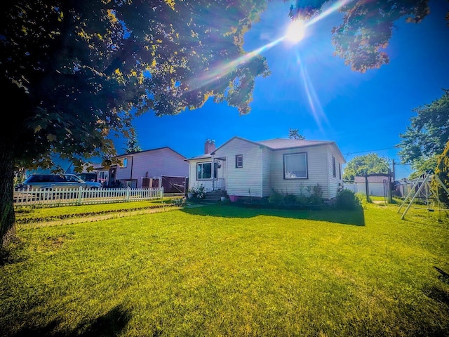 4015 N Ash St, Spokane, WA 99205 - back of house featuring entry steps, a chimney, and a playground