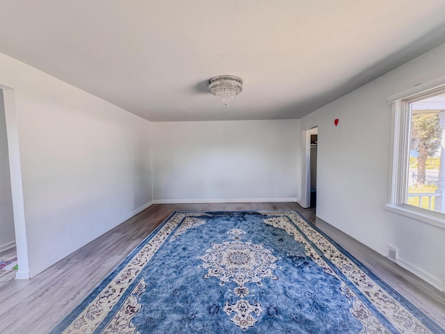 4015 N Ash St, Spokane, WA 99205 - empty room with wood finished floors and baseboards