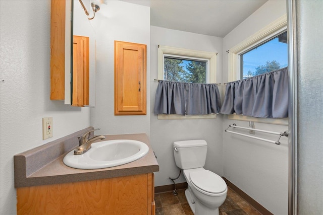 2828 S Arthur St, Spokane, WA 99203 - half bath featuring vanity, toilet, and baseboards