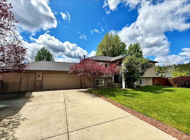 18306 E 9th Ave, Spokane Valley, WA 99016 - obstructed view of property with driveway and a garage