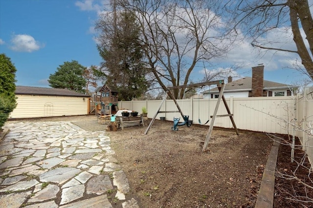 10503 E Valleyway Ave, Spokane Valley, WA 99206 - fenced backyard with a playground and a patio