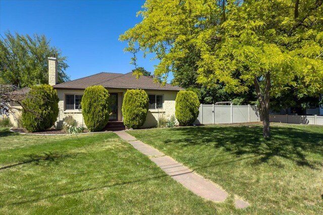 10503 E Valleyway Ave, Spokane Valley, WA 99206 - view of front of home featuring a chimney, entry steps, and stucco siding