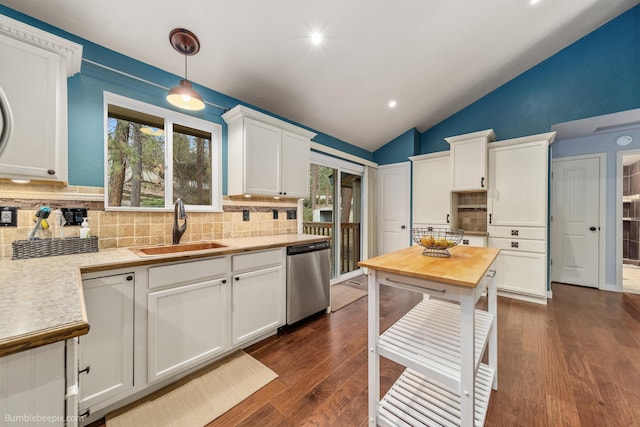 4116 W Indian Trail Rd, Spokane, WA 99208 - kitchen featuring stainless steel dishwasher, a sink, lofted ceiling, decorative backsplash, and white cabinets