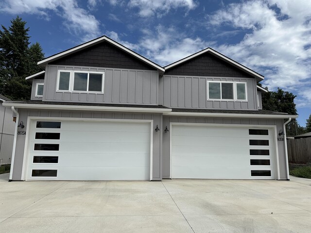 805 E F St, Deer Park, WA 99006 - view of front of property featuring an attached garage, concrete driveway, and board and batten siding
