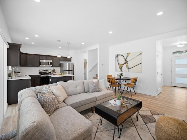 805 E F St, Deer Park, WA 99006 - living area with light wood-style floors, recessed lighting, baseboards, and stairs