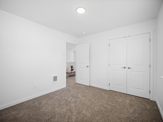 805 E F St, Deer Park, WA 99006 - unfurnished bedroom with carpet flooring, baseboards, and a closet