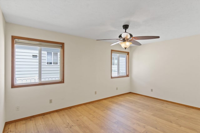 11103 E Main Ave, Spokane Valley, WA 99206 - spare room featuring ceiling fan, baseboards, and light wood-type flooring