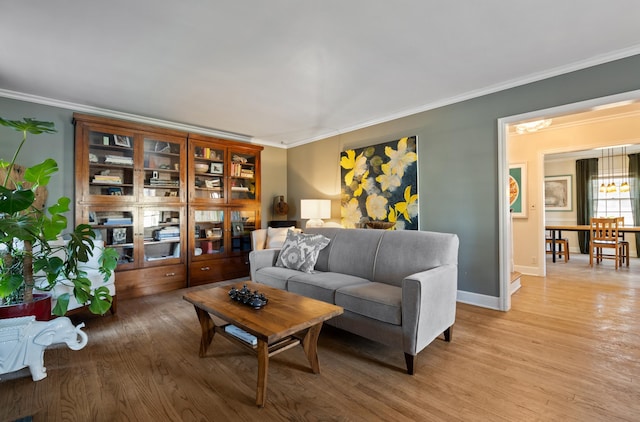 704 E 20th Ave, Spokane, WA 99203 - living room featuring ornamental molding, light wood-style flooring, and baseboards