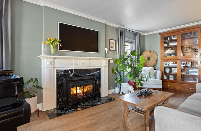 704 E 20th Ave, Spokane, WA 99203 - living area with a premium fireplace, crown molding, wood finished floors, and baseboards