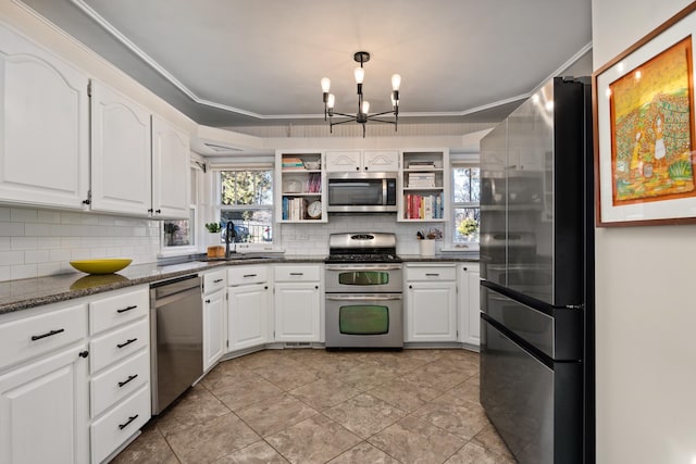 704 E 20th Ave, Spokane, WA 99203 - kitchen with stainless steel appliances, a chandelier, open shelves, backsplash, and a sink