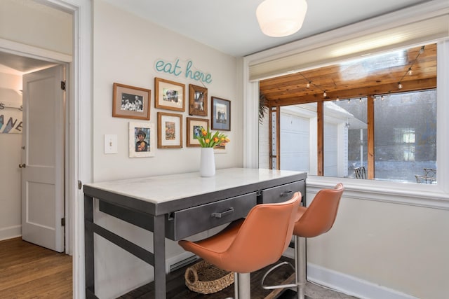704 E 20th Ave, Spokane, WA 99203 - dining room featuring baseboards and wood finished floors