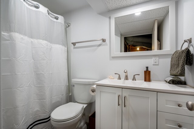 704 E 20th Ave, Spokane, WA 99203 - full bath with vanity, toilet, a drop ceiling, and a shower with curtain