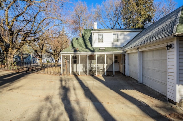 704 E 20th Ave, Spokane, WA 99203 - view of front of home featuring driveway, a chimney, a shingled roof, and a garage