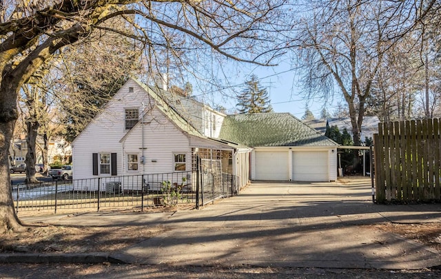 704 E 20th Ave, Spokane, WA 99203 - view of front of house with concrete driveway and an attached garage
