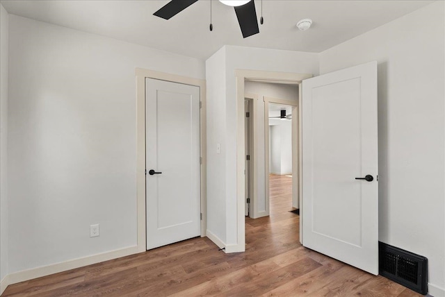 1403 N Farr Rd, Spokane, WA 99206 - unfurnished bedroom with wood finished floors, baseboards, and ceiling fan