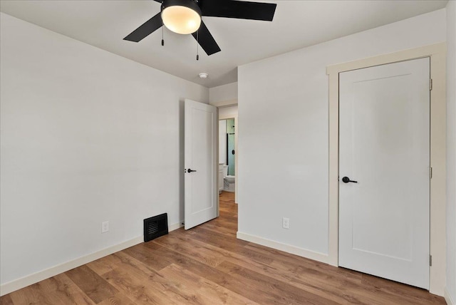 1403 N Farr Rd, Spokane, WA 99206 - unfurnished bedroom with wood finished floors, baseboards, and ceiling fan