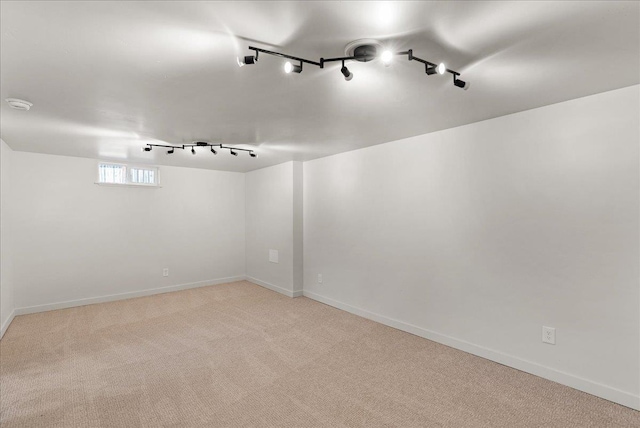 1403 N Farr Rd, Spokane, WA 99206 - unfurnished room featuring track lighting, baseboards, light carpet, and a smoke detector