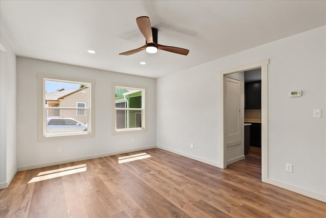 1403 N Farr Rd, Spokane, WA 99206 - empty room featuring light wood-style flooring, baseboards, ceiling fan, and recessed lighting