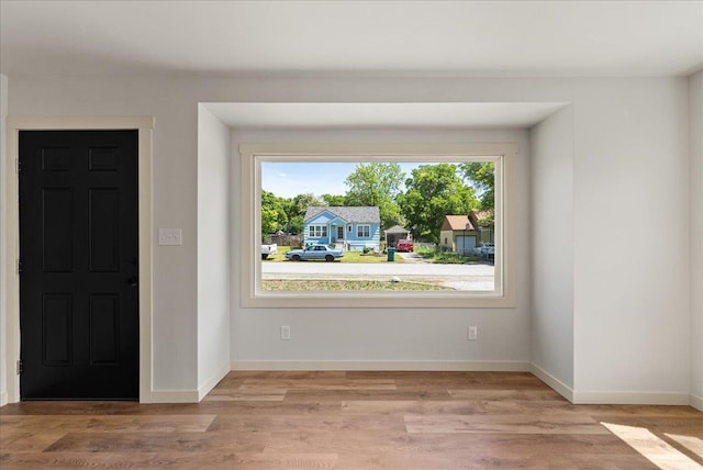1403 N Farr Rd, Spokane, WA 99206 - empty room featuring healthy amount of natural light, light wood-style floors, and baseboards