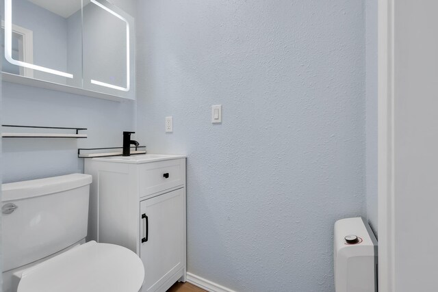 28600 N Mt Spokane Park Dr Unit 603, Mead, WA 99021 - bathroom featuring toilet, vanity, and baseboards