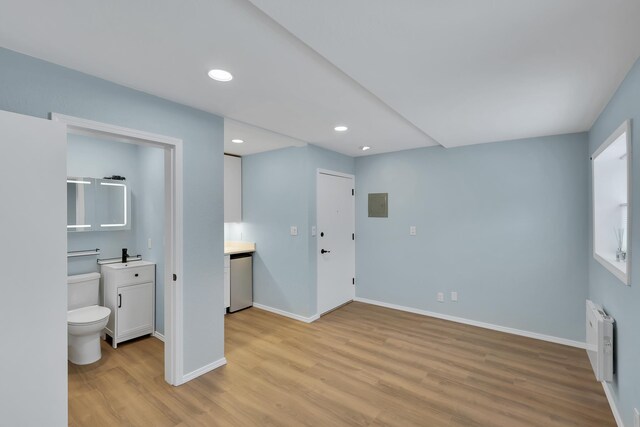 28600 N Mt Spokane Park Dr Unit 603, Mead, WA 99021 - entrance foyer with light wood finished floors, radiator heating unit, baseboards, recessed lighting, and electric panel