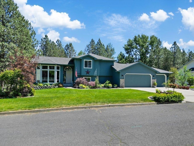4510 E Bixel Ct, Mead, WA 99021 - tri-level home with a garage, a front yard, and concrete driveway