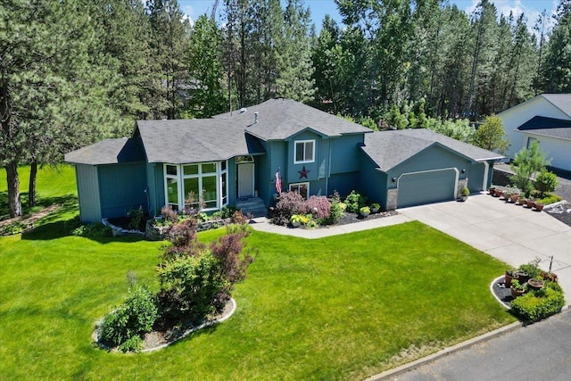 4510 E Bixel Ct, Mead, WA 99021 - view of front of property with concrete driveway, a garage, and a front lawn