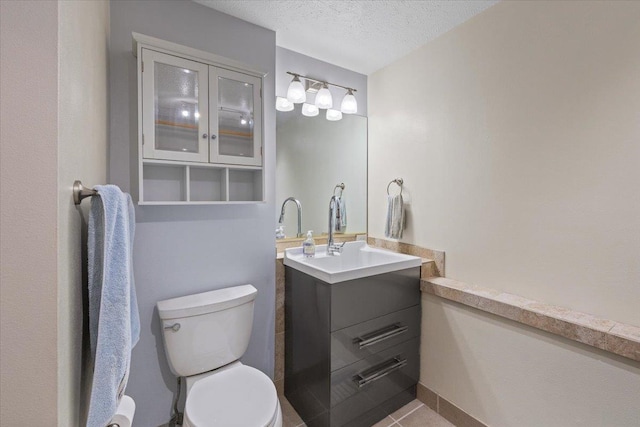 4510 E Bixel Ct, Mead, WA 99021 - bathroom with vanity, toilet, tile patterned flooring, and a textured ceiling
