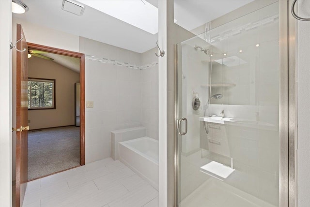 4510 E Bixel Ct, Mead, WA 99021 - bathroom with a stall shower, vaulted ceiling, a garden tub, and tile patterned flooring