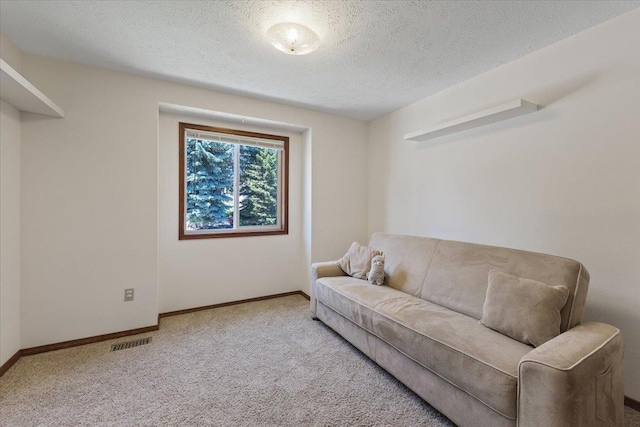4510 E Bixel Ct, Mead, WA 99021 - living area featuring carpet, a textured ceiling, and baseboards