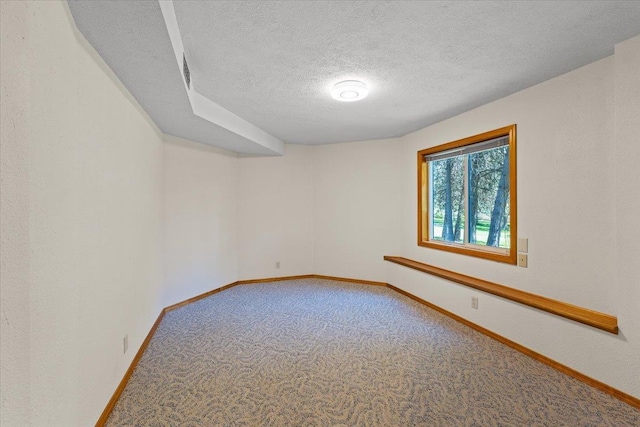 4510 E Bixel Ct, Mead, WA 99021 - carpeted empty room with a textured ceiling and baseboards
