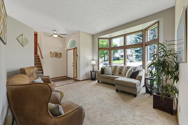 4510 E Bixel Ct, Mead, WA 99021 - living room with light carpet, stairway, a textured ceiling, a ceiling fan, and baseboards